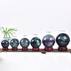 JIC Gem Colorful Fluorite Crystal Ball with Wooden Stand Healing Crystal Sphere Ball for Feng Shui Decor Spiritual Gifts 70-80mm