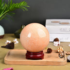 JIC Gem Big Sparkling Quartz Crystal Ball Sunstone Healing Crystal Gemstone Sphere with Decorative Wooden Stand for Meditation Gifts Decoration (80-90mm)