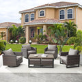 Wicker Furniture Set: 7 Piece Outdoor Furniture Set with 2 Swivel Chairs, 2 Single Chairs, Coffee Table and 2 Ottomans - Brown / Grey